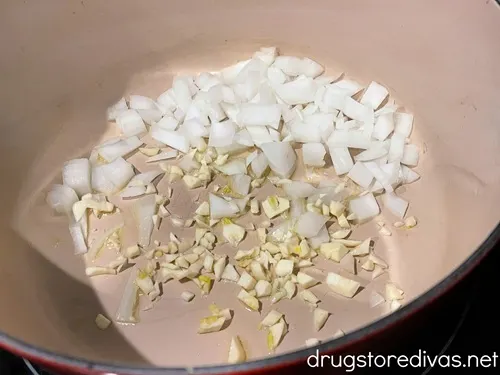 Chopped onion and garlic in a Dutch oven.