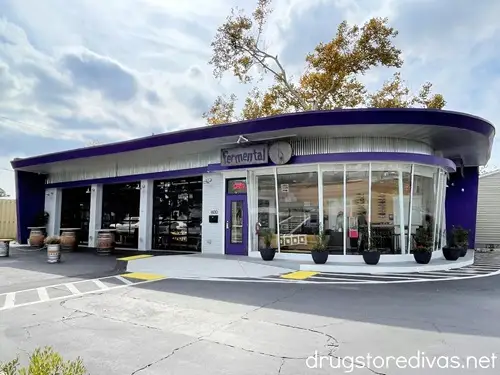 An old gas station with a purple roof that was converted to the bar Fermental in The Cargo District in Wilmington, NC.
