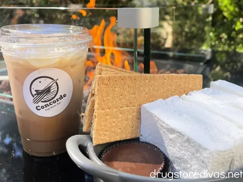 Coffee and s'mores ingredients with a flame behind them at Concorde Espresso Bar in Wilmington, NC.