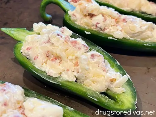 Jalapeno pepper halves stuffed with a cream cheese mixture.