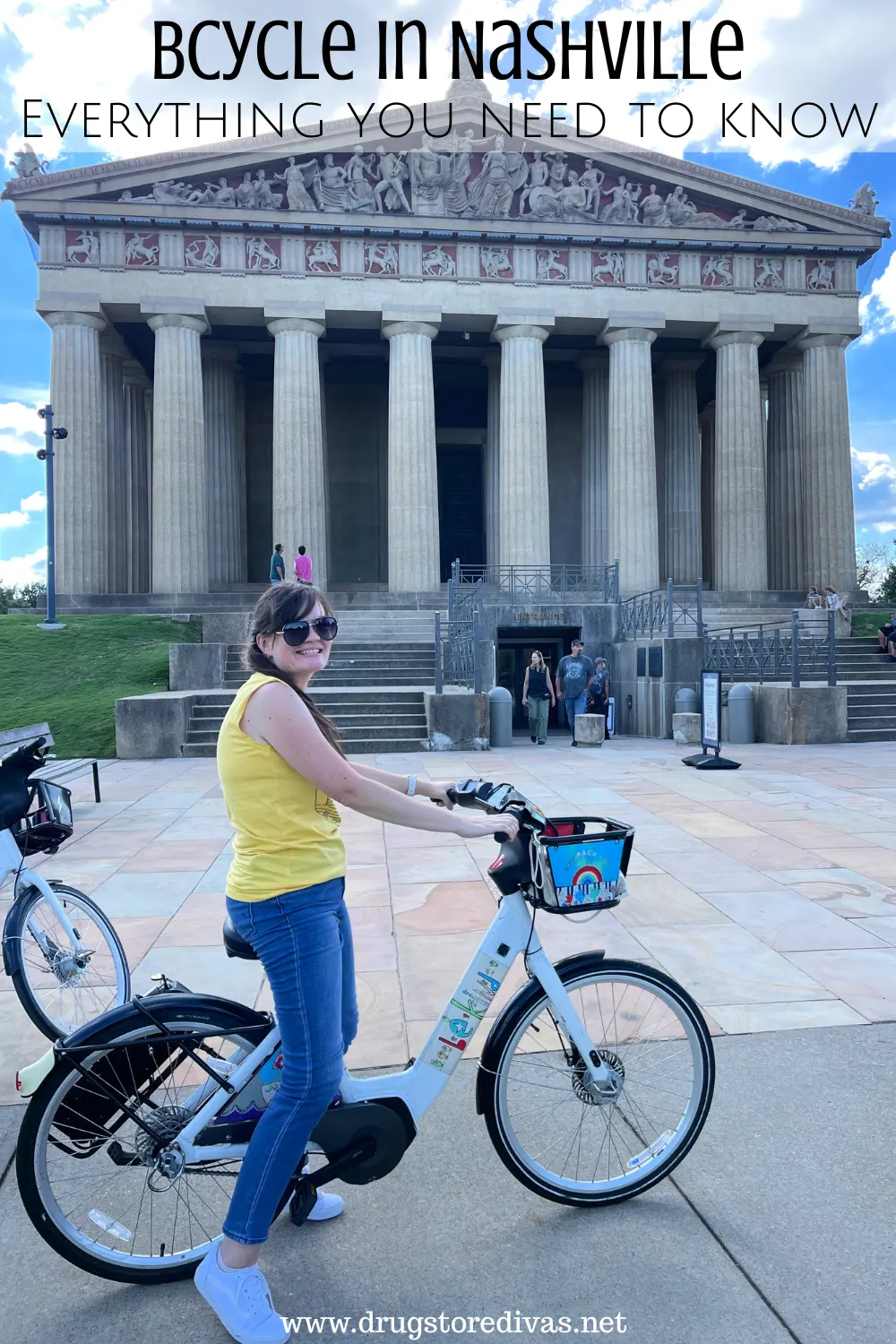 A woman in a yellow tank top on a bike in front of the Parthenon in Nashville with the words 