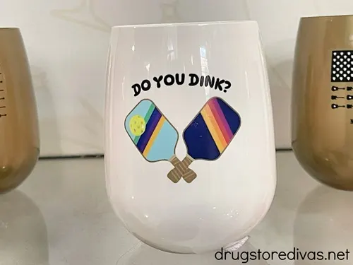 A white cup that says Do You Dink on it.