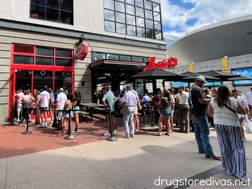People waiting on line outside of Hattie B's Hot Chicken in Assembly Hall in Nashville.