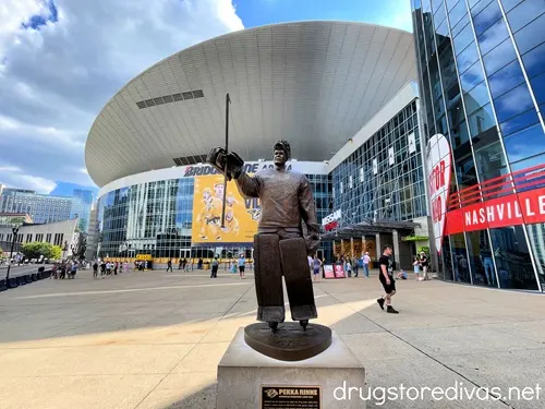 A bronze statue of a hockey player in front of Bridgestone Arena in Nashville.