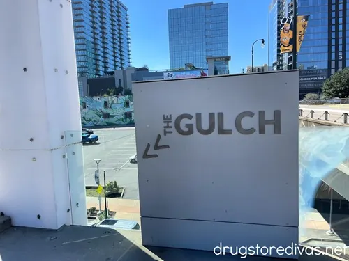 A sign pointing towards The Gulch section of Nashville, Tennessee.