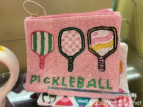 A pink beaded wallet with three pickleball paddles and the word pickleball on it.