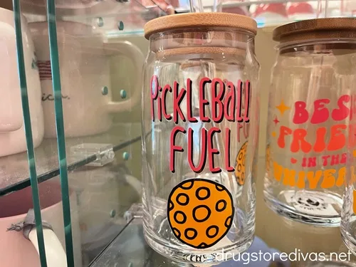 A glass cup with a top and straw that says Pickleball Fuel on it.