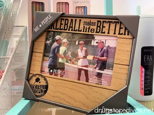 A picture frame that says "Pickleball Makes Life Better" on it.