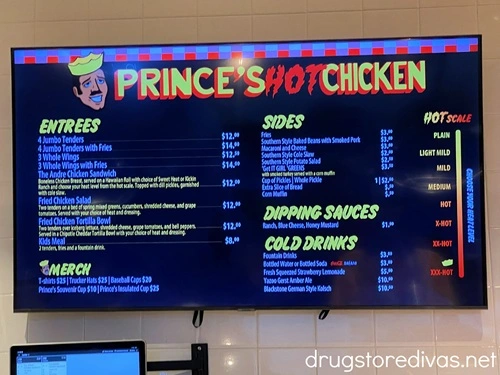 Prince's Hot Chicken menu with prices on a wall.