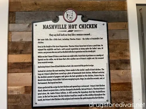 A plaque on a wall telling this history of Prince's Hot Chicken.