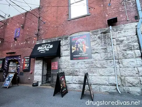 The outside of a basement bar called Skulls Rainbow Room in Nashville.