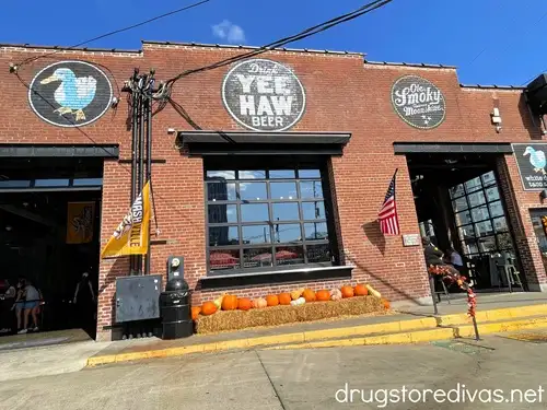 A brick building with pumpkins in front that houses Yee Haw Brewing in Nashville.