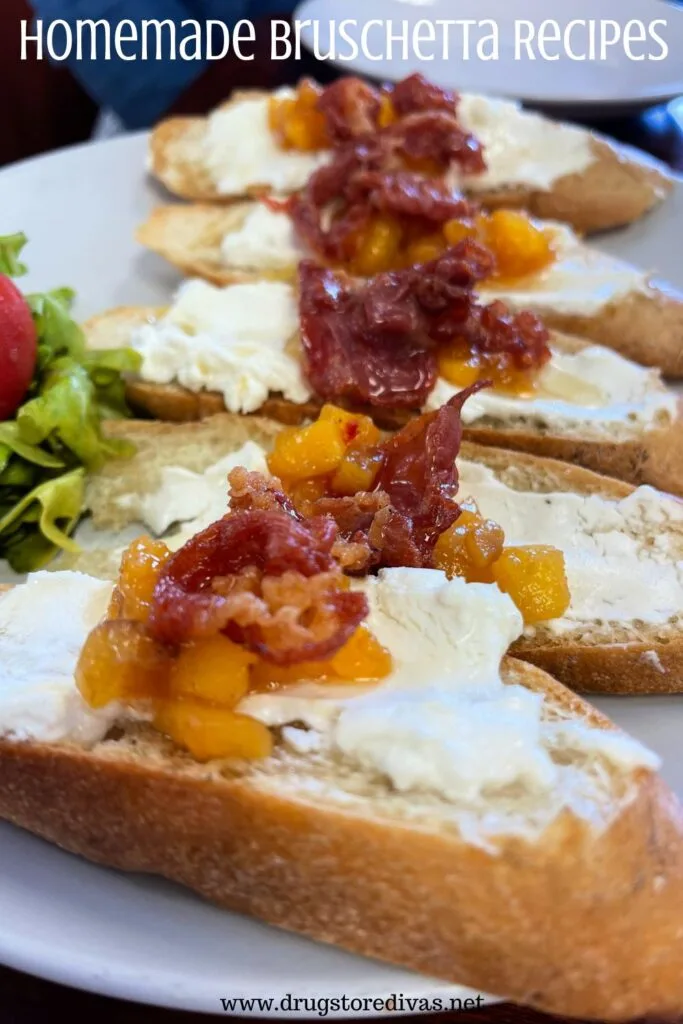 Pieces of bruschetta with goat cheese and diced peaches on top with the words "Homemade Bruschetta Recipes" digitally written on top.