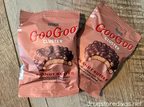 Two individually wrapped peanut butter Goo Goo Cluster chocolates.