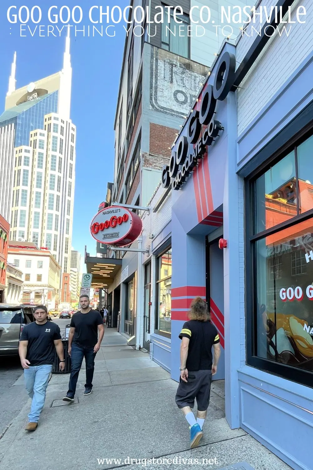 The street view outside of Goo Goo Chocolate in Nashville, with the famous Batman Building in the back, with the words 