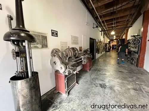A man looking at car parts along a long hallway at Marathon Village in Nashville.