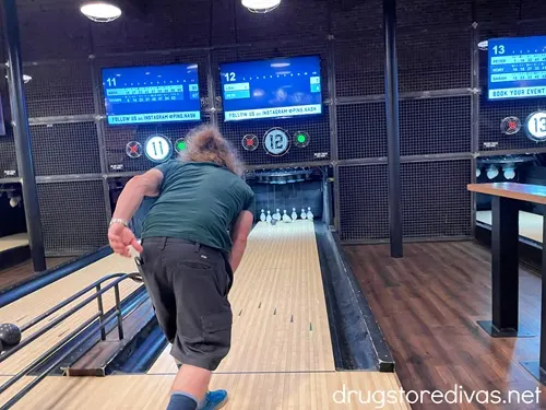 A man playing duckpin bowling at Pins Mechanical Co in Nashville.