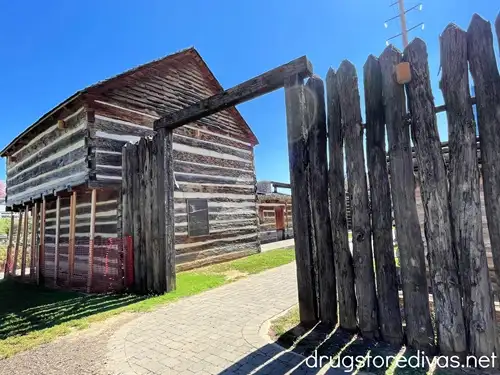 The wooden entrance and a log cabin, which are part of Fort Nashborough in Nashville.
