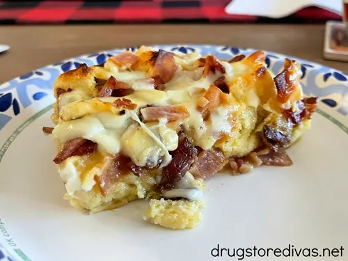 A slice of Hawaiian Bread Breakfast casserole on a plate with a blue and white edge.