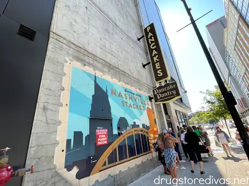 The outside of Pancake Pantry in Nashville with a huge mural on the wall.