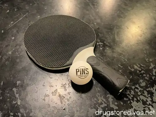 A ping pong paddle and ball at Pins Mechanical Co in Nashville.