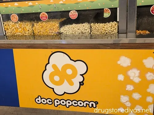The front of a Doc Popcorn kiosk in a mall.