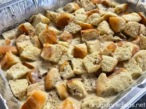 Unbaked Hawaiian Roll Bread Pudding in an aluminum pan.