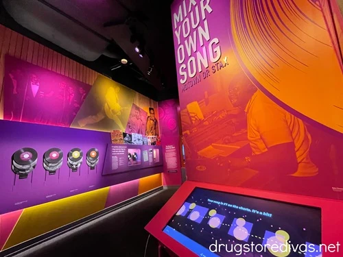 A touchscreen exhibit and records on the walls at the National Museum Of African American Music in Nashville.