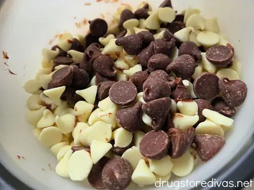 Milk and white chocolate chips in a bowl.