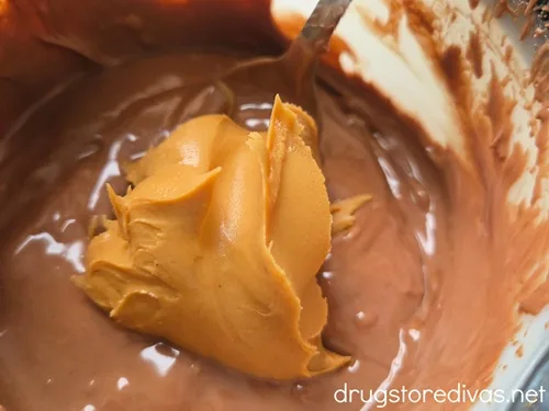 A scoop of peanut butter in melted chocolate.