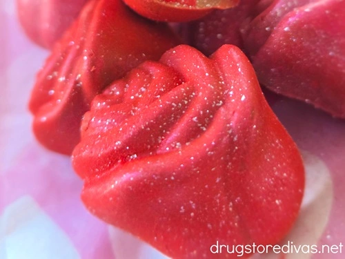 Pink glittered rose-shaped chocolates.