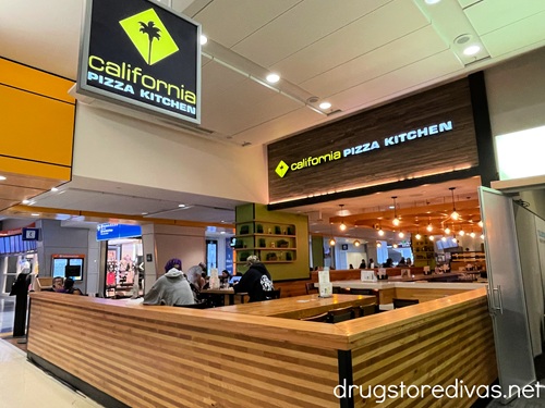 The outside of a California Pizza Kitchen restaurant.