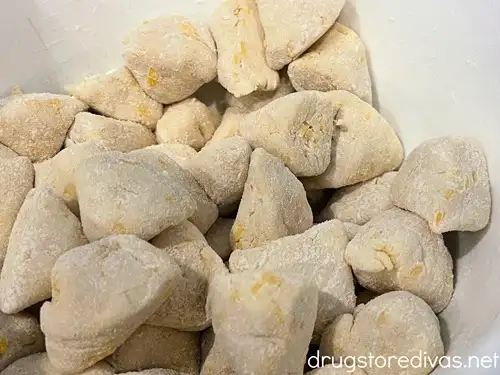 Biscuit pieces in a white bowl.