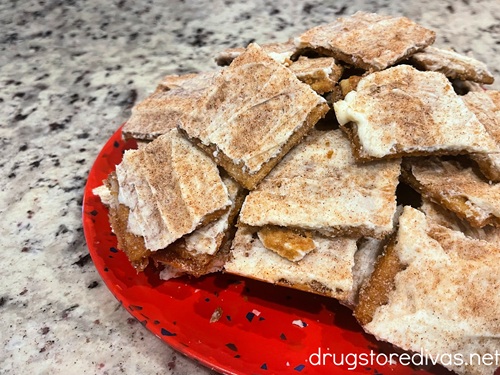 A huge pile of churro saltine cracker toffee bark on a red speckled plate.