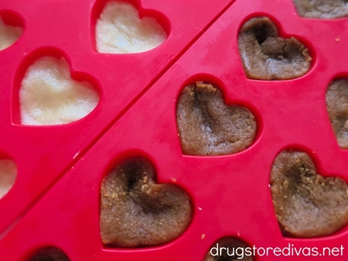 Unbaked cookie batter in heart shape molds.