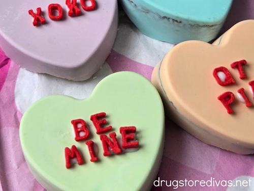 Conversation Heart Cookies with red letter sprinkles on them.