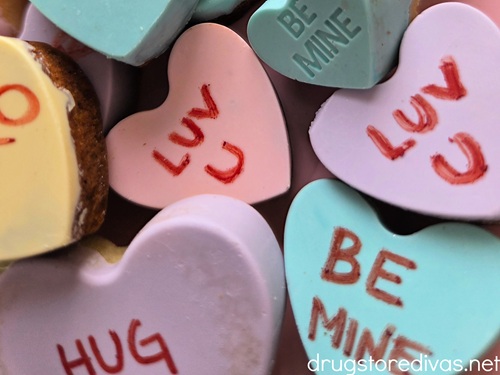 Conversation Heart Cookies with red letters written on them.