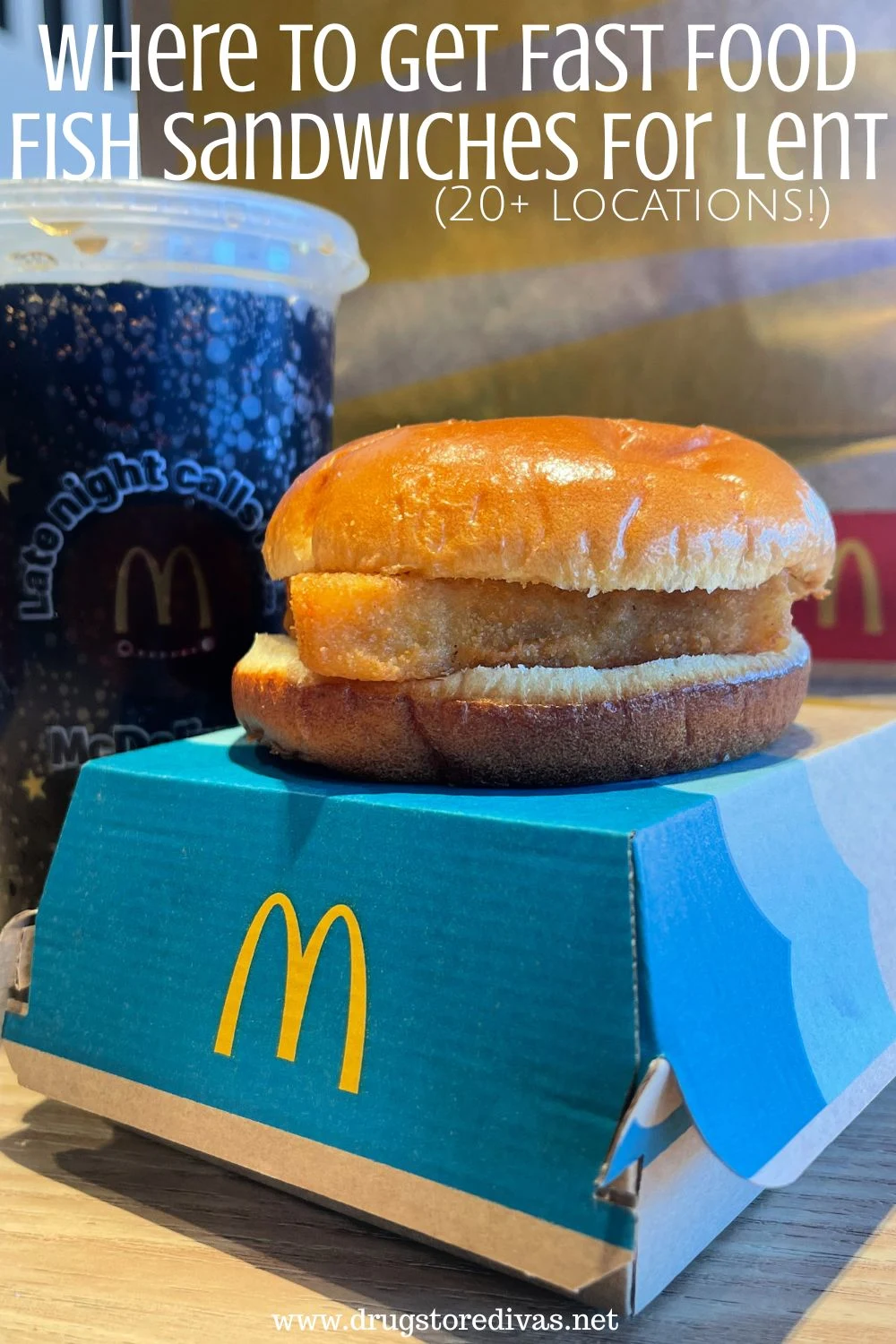 A fish sandwich on top of a blue McDonald's box in front of a soda and a McDonald's bag with the words 
