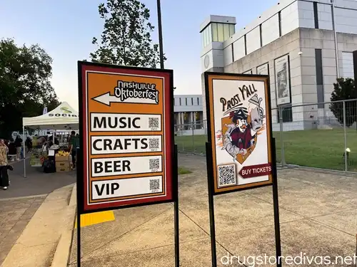 Signs directing people to areas at Nashville Oktoberfest.