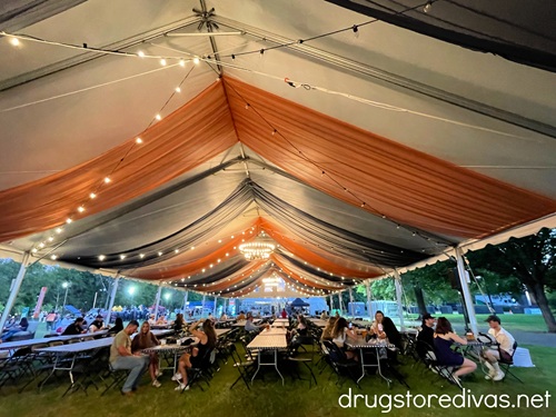 A large beer tent with people under it at Nashville Oktoberfest.