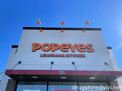 The outside of a Popeyes restaurant.