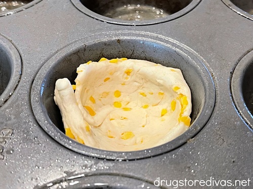 A biscuit in a muffin pan.