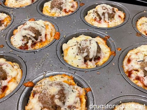 Baked mini meatball sliders in a muffin tin.