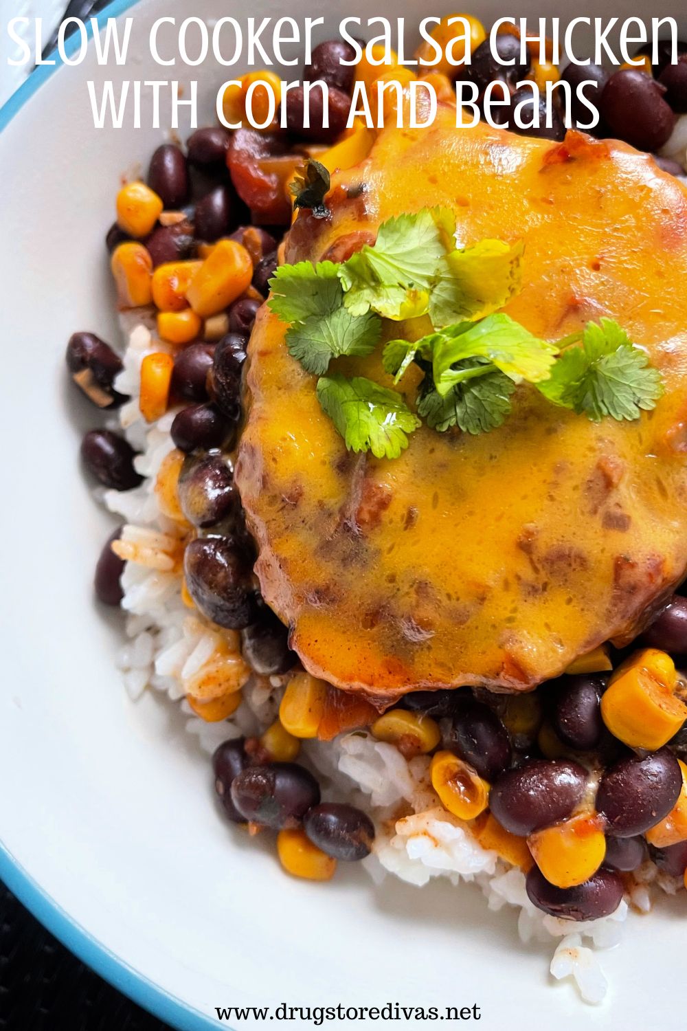 Chicken with melted cheese and green herbs on top of rice with beans and corn in a bowl and the words 