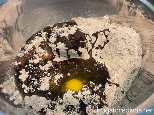 Brownie mix and an egg in a bowl.