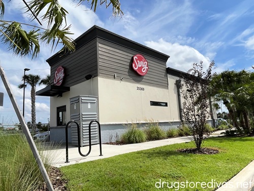 The outside of a Swig drive through soda shop.