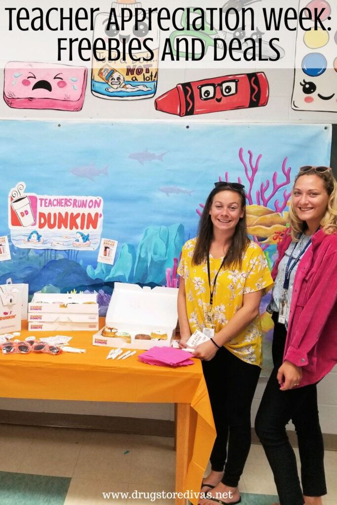 Two women on the right side of a table that's filled with Dunkin' donuts in the art room of a school with the words "Teachers Appreciation Week: Freebies And Deals" digitally written above them.