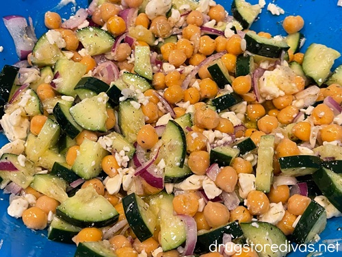 Cucumber chickpea salad in a blue bowl.
