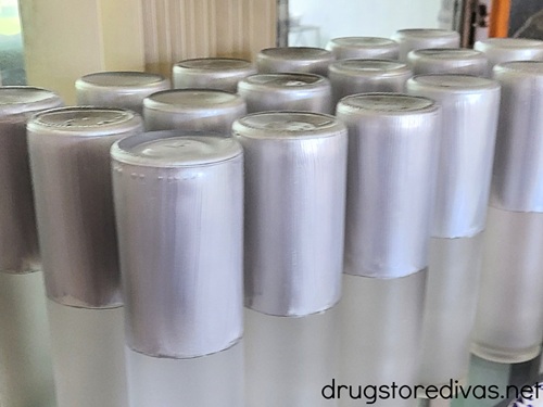 Tall candles with the top half painted silver.