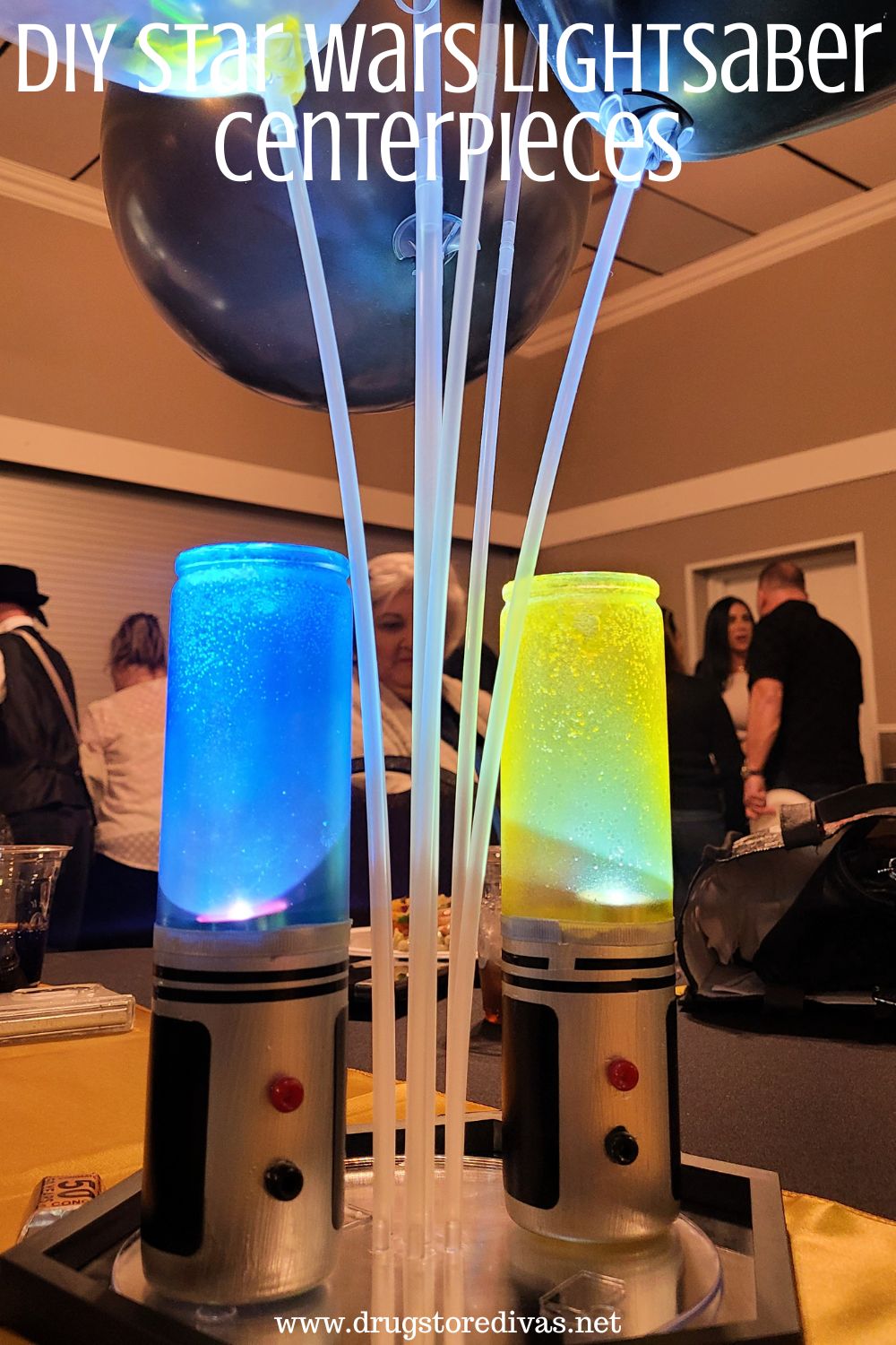 A blue and yellow DIY lightsaber on a mirror as a party centerpiece with the words 